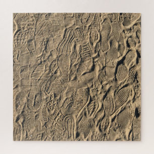 Schuhdrucke im Sand
