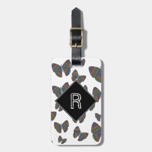 Schwarm von Schmetterlingen mit farbigen Streifen Gepäckanhänger