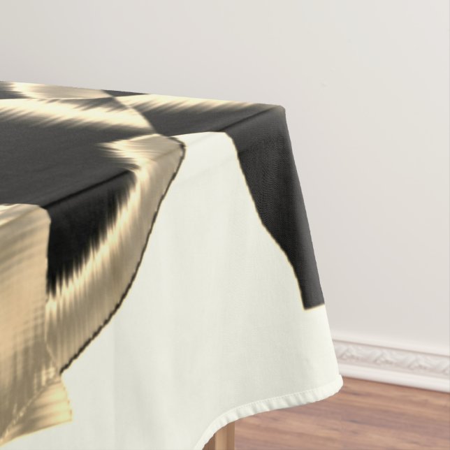 Schwarz-Beige-Schrott, zerstörte Bänder auf klarem Tischdecke (Beispiel)