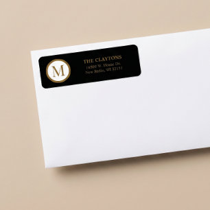 Schwarz-Gold-Monogramm mit zentralem Siegel