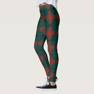 Schwarz-rot-Kugeln oder Löcher über grünem Hinterg Leggings