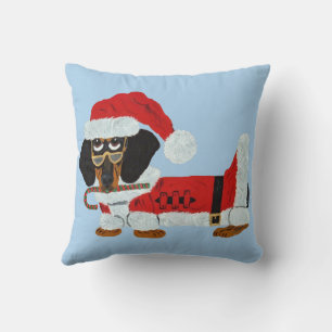 Schwarz-roter Dachshund Weihnachtsmann mit einem Z Kissen