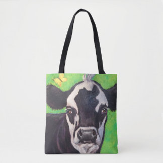 Schwarz-Weiß-Kuh mit Kelly Green Tasche