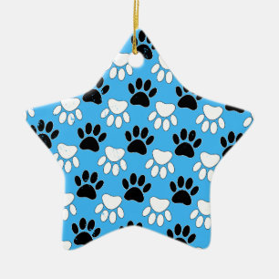 Schwarz-Weiß-Pfoten auf blauem Hintergrund Keramikornament