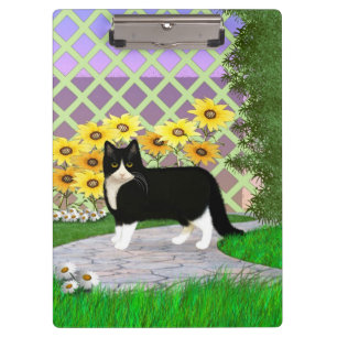 Schwarz-Weiß Tuxedo Katze im Garten Klemmbrett