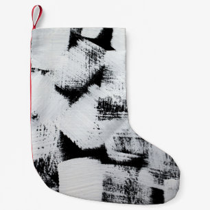 Schwarz-weiße, abstrakt gestrichene Leinwand. Kleiner Weihnachtsstrumpf