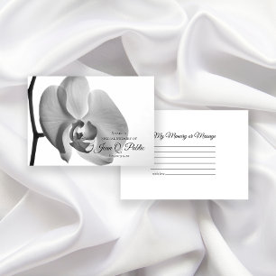 Schwarz-weiße Orchid-Blume gemeinsam mit einer Ged Mitteilungskarte