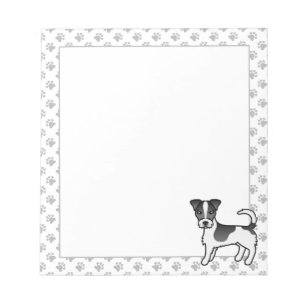 Schwarz-weißer Jack-Russell-Terrier-Hund mit rauem Notizblock