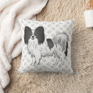 Schwarz-weißer Papillon-Cartoon-Hund mit Pfoten Kissen