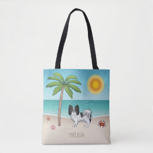 Schwarz-weißer Papillon-Hund am tropischen Sommers Tasche
