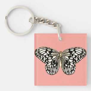 Schwarz-weißer Schmetterling, korallenrosa Hinterg Schlüsselanhänger