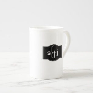 Schwarz-weißes Etikett Mit Monogramm Prozellantasse