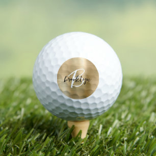 Schwarz-weißes Monogramm aus goldgegossenem Metall Golfball