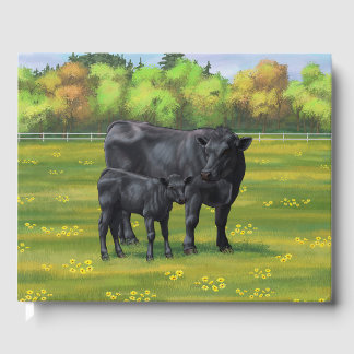 Schwarze Anguskühe und Niedliches Kalb im Sommerwe Gästebuch