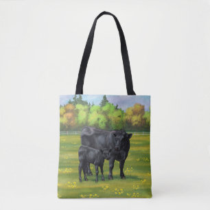 Schwarze Anguskühe und Niedliches Kalb im Sommerwe Tasche