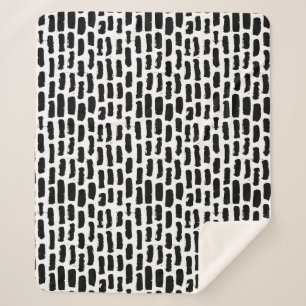 Schwarze Bürste streicht Muster Sherpadecke