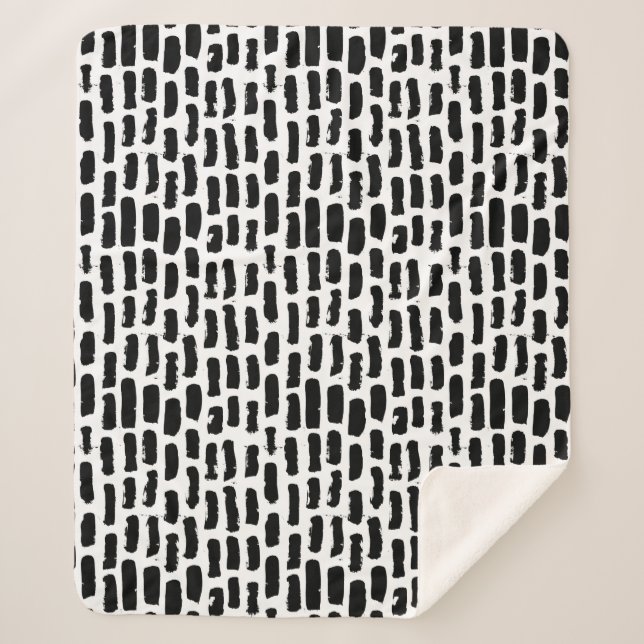 Schwarze Bürste streicht Muster Sherpadecke (Vorderseite)