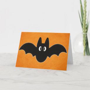 Schwarze Fledermaus auf orangem Hintergrund Karte