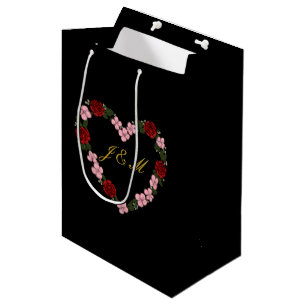 Schwarze Geschenktasche mit rosa und rotem Herzen Mittlere Geschenktüte