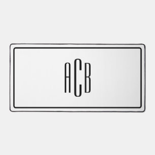 Schwarze Grenze: Drei Buchstaben blaues Monogramm Schreibtischunterlage