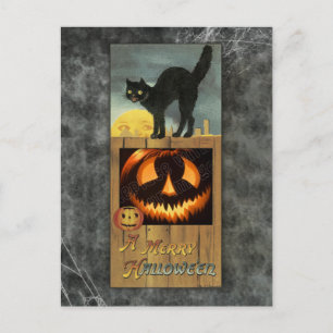 Schwarze Katze auf einem Holzzaun mit Kürbis Postkarte