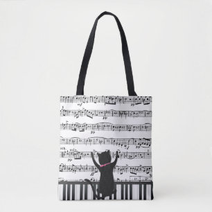 Schwarze Katze auf Klaviertasten Tasche