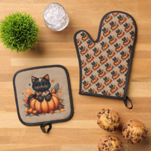 Schwarze Katze auf Kürbis mit Herbstquiltmuster Ofenhandschuh & Topflappen-Set