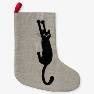Schwarze Katze, die an der Imitat-Leinenart Kleiner Weihnachtsstrumpf