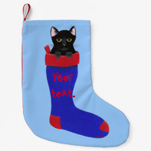 Schwarze Katze im roten und blauen Kleiner Weihnachtsstrumpf
