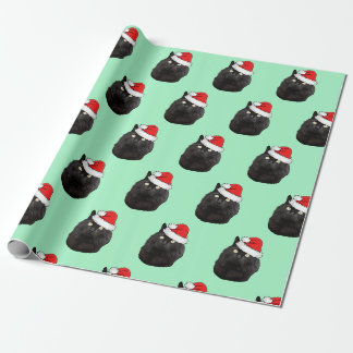Schwarze Katze mit einer Weihnachtsmannmütze Geschenkpapier
