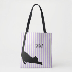 Schwarze Katze mit langen Schwänzen über die Tasch Tasche