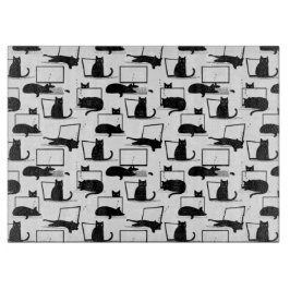 Schwarze Katzen auf Laptops Schneidebrett