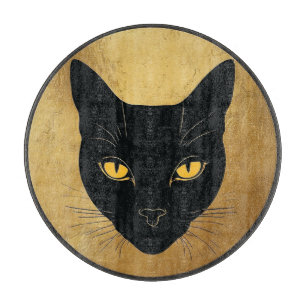 Schwarze Katzensilhouette vor einem goldenen Kreis Schneidebrett