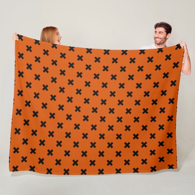 Schwarze Kreuzstiche auf Orange Fleecedecke (Beispiel)