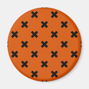 Schwarze Kreuzstiche auf Orange Magnet