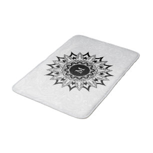 Schwarze Mandala auf einem weißen Pisley Badematte