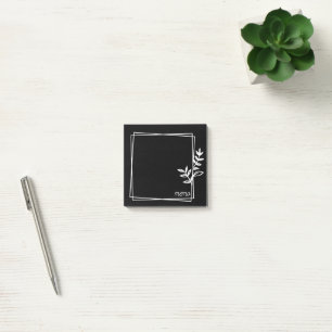 Schwarze Notizen mit weißem Doppelrahmen mit Blume