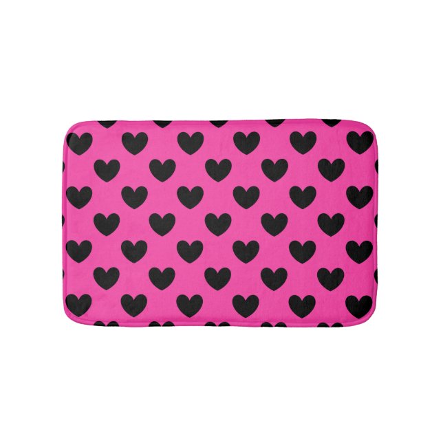 Schwarze Polka Herzen auf Fuchsienrosa Badematte (Vorderseite)