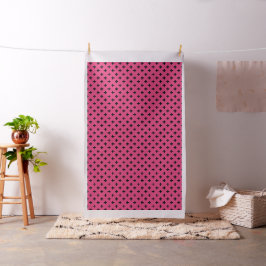 Schwarze Polka-Kreuze auf Fuchsia Stoff