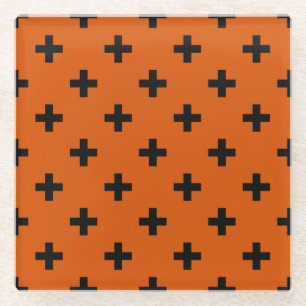 Schwarze Polka-Kreuze auf Orange Glasuntersetzer