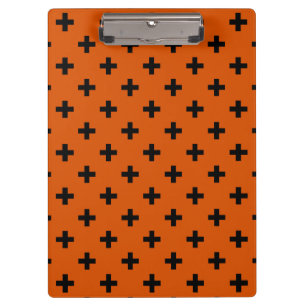 Schwarze Polka-Kreuze auf Orange Klemmbrett