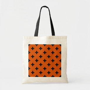 Schwarze Polka-Kreuze auf Orange Tragetasche