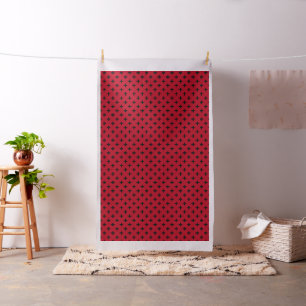 Schwarze Polka Kreuze auf rot Stoff