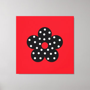 Schwarze Polka-Punkt-Blume auf rotem Hintergrund Leinwanddruck