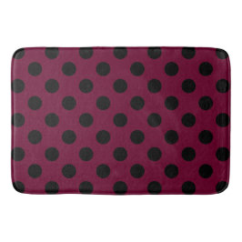 Schwarze Polka-Punkte auf Bordeaux Badematte