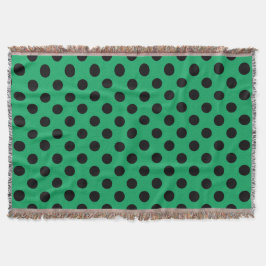 Schwarze Polka Punkte auf frisch grünem Decke
