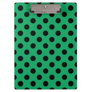 Schwarze Polka Punkte auf frisch grünem Klemmbrett