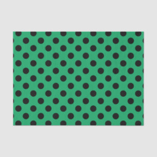 Schwarze Polka Punkte auf frisch grünem Seidenpapier
