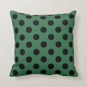 Schwarze Polka-Punkte auf kelgrün Kissen