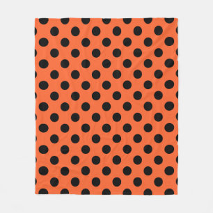 Schwarze Polka-Punkte auf Orange Fleecedecke